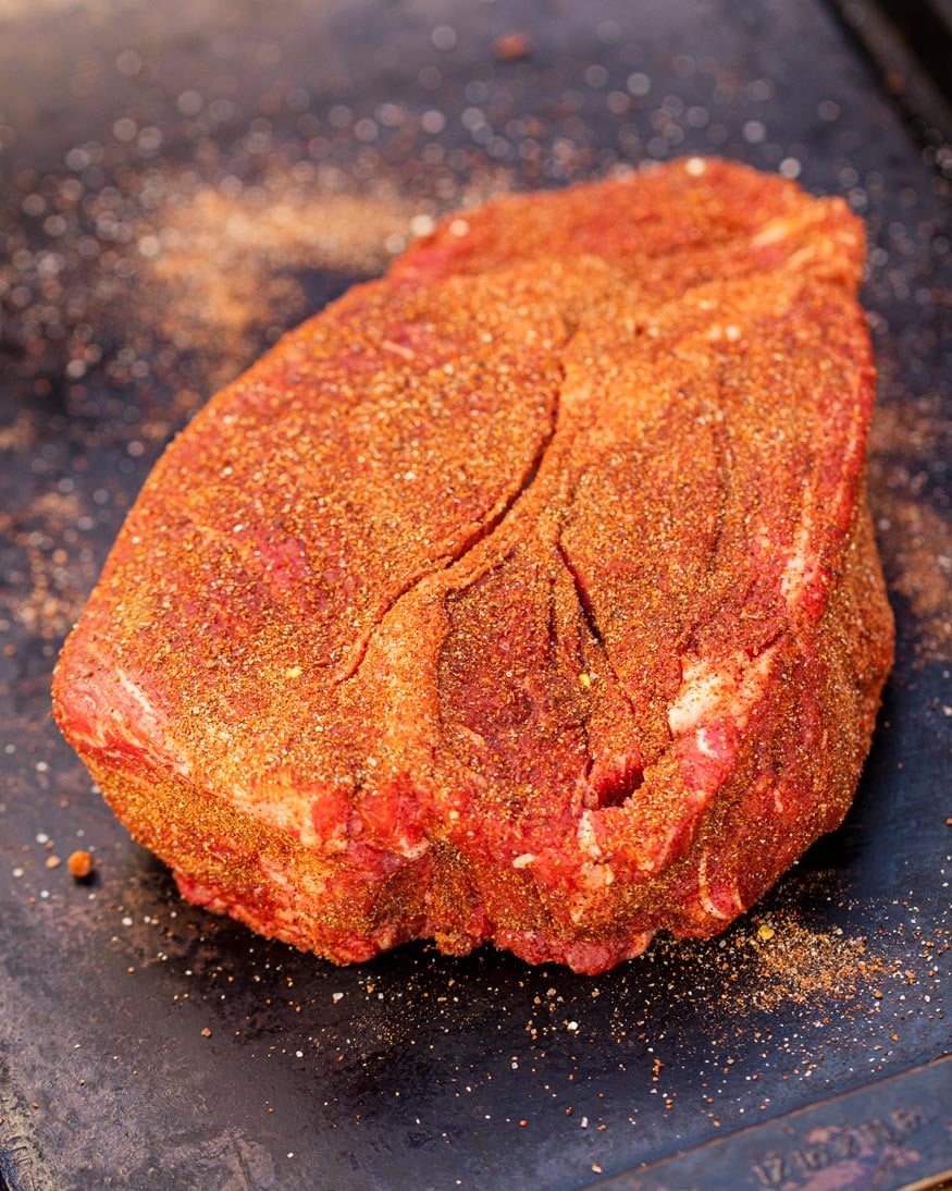 Chuck roast, seasoned heavily for the smoker.