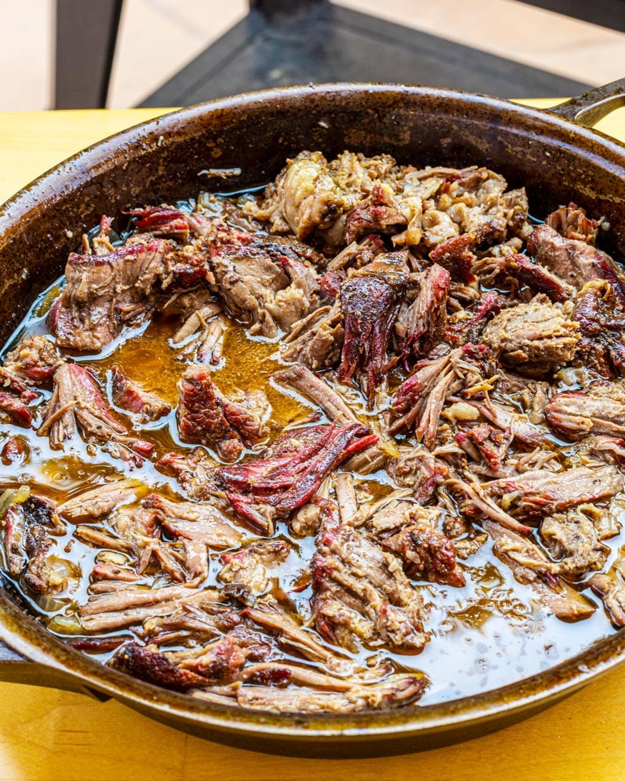 Chuck roast, shredded beef with jus and onions.