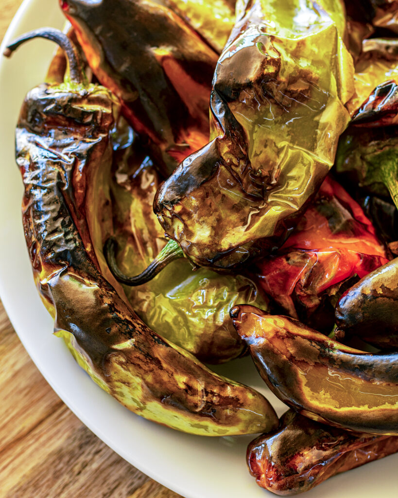 Roasted Hatch chile peppers with different colors.