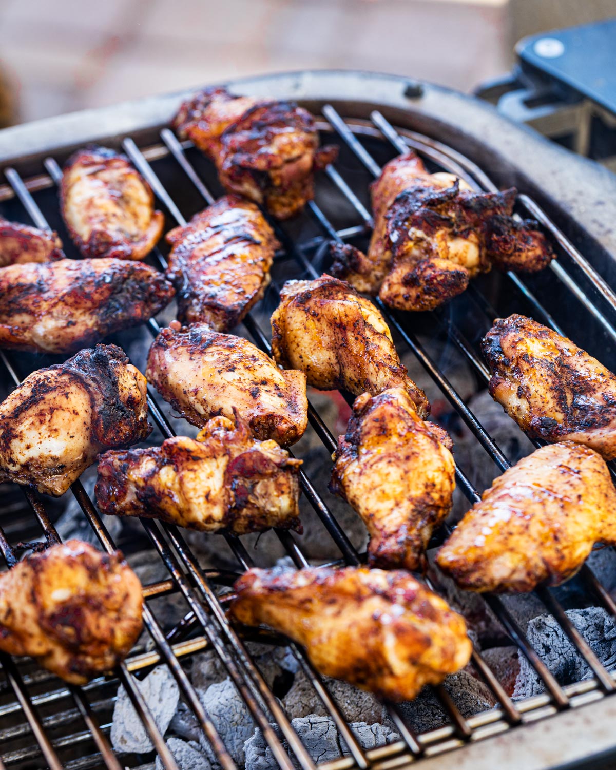 Searing the smoked chicken wings over the coals