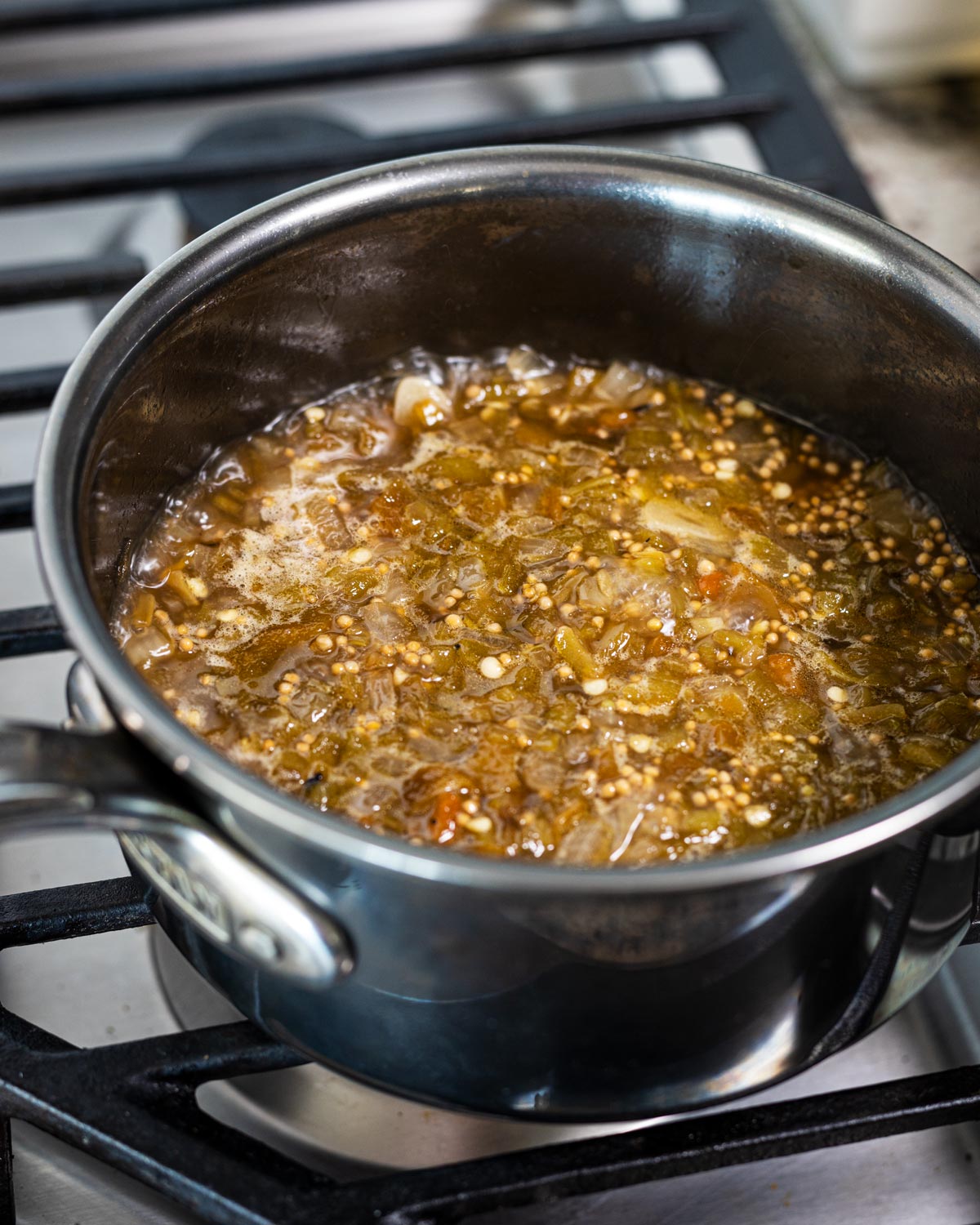 Simmering all of the ingredients for about 30 minutes so it thickens into a chile jam