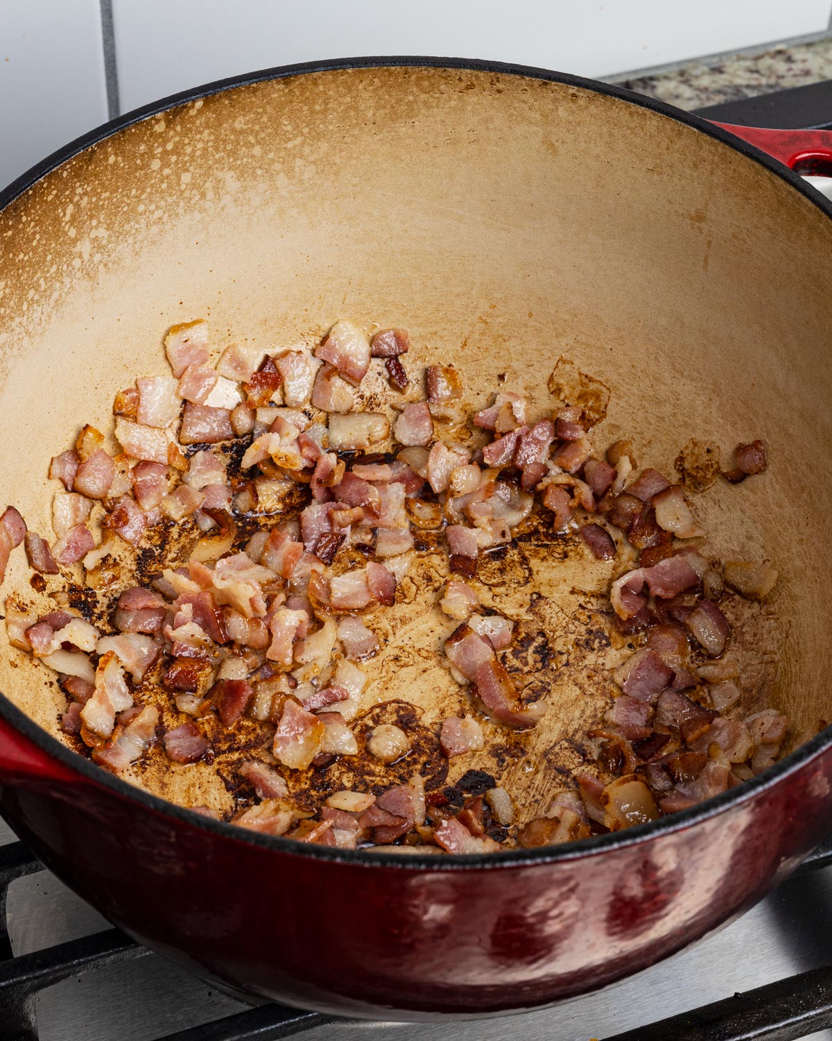 Slowly crisp up the bacon then remove it, leaving the bacon fat behind.
