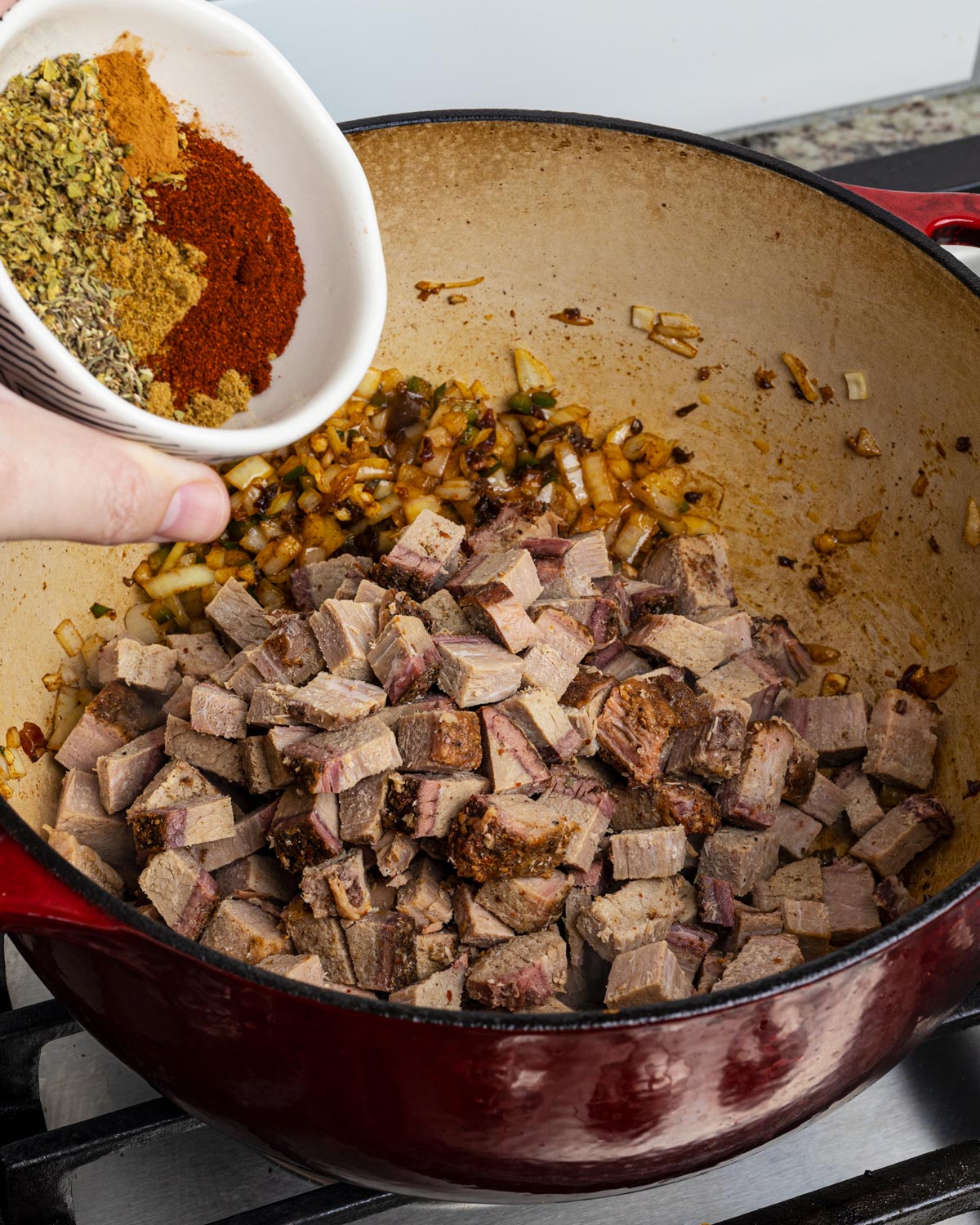 Add the leftover brisket into the pot with all of the spices.