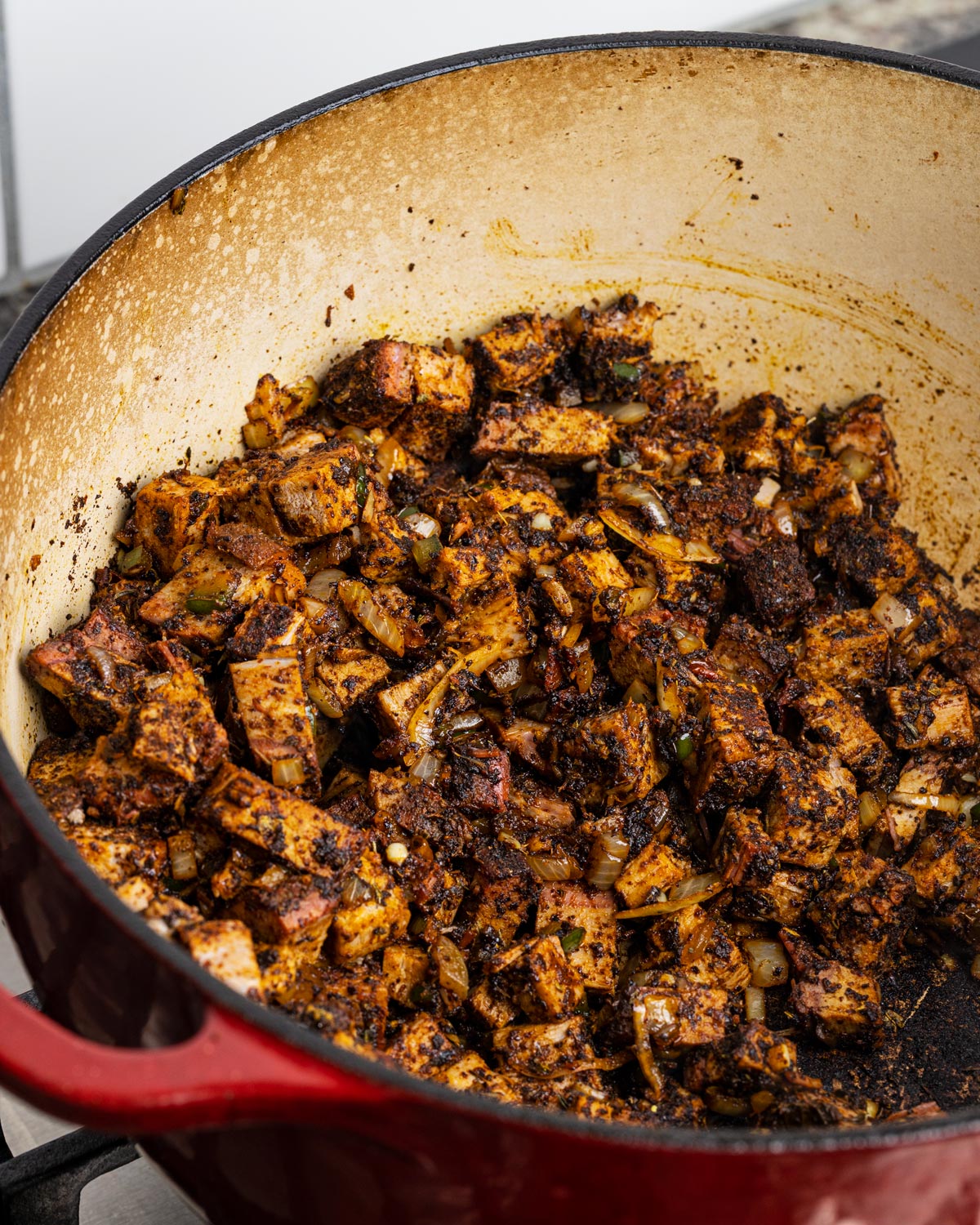 Stir the meat to coat with spices for a few minutes, allowing them to toast briefly.