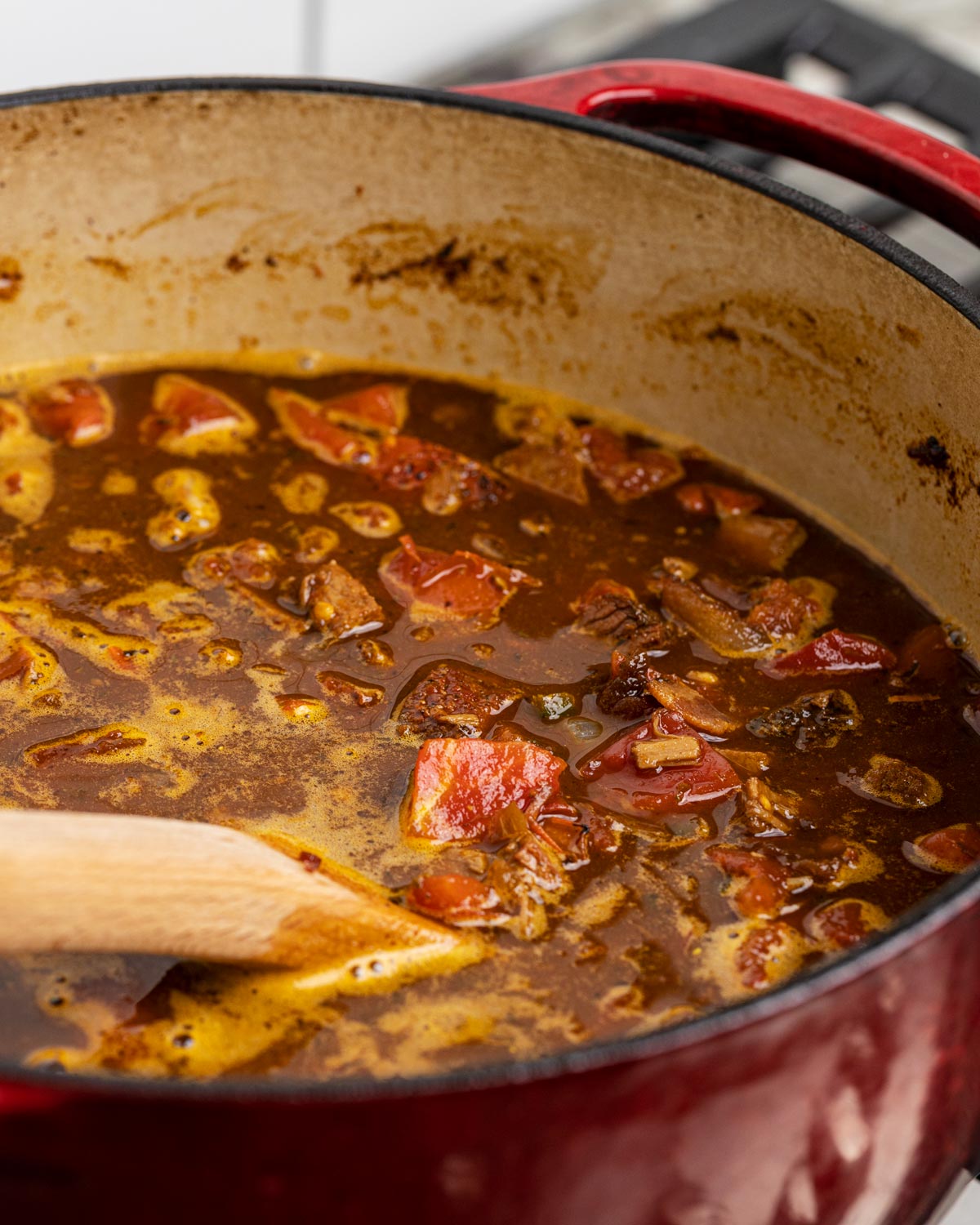 Add all of the liquids into the pot and bring to a simmer.
