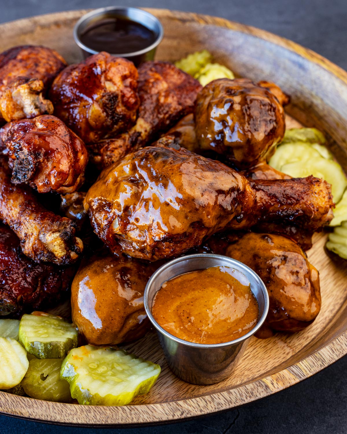 Smoked drumsticks with a side of maple chipotle sauce