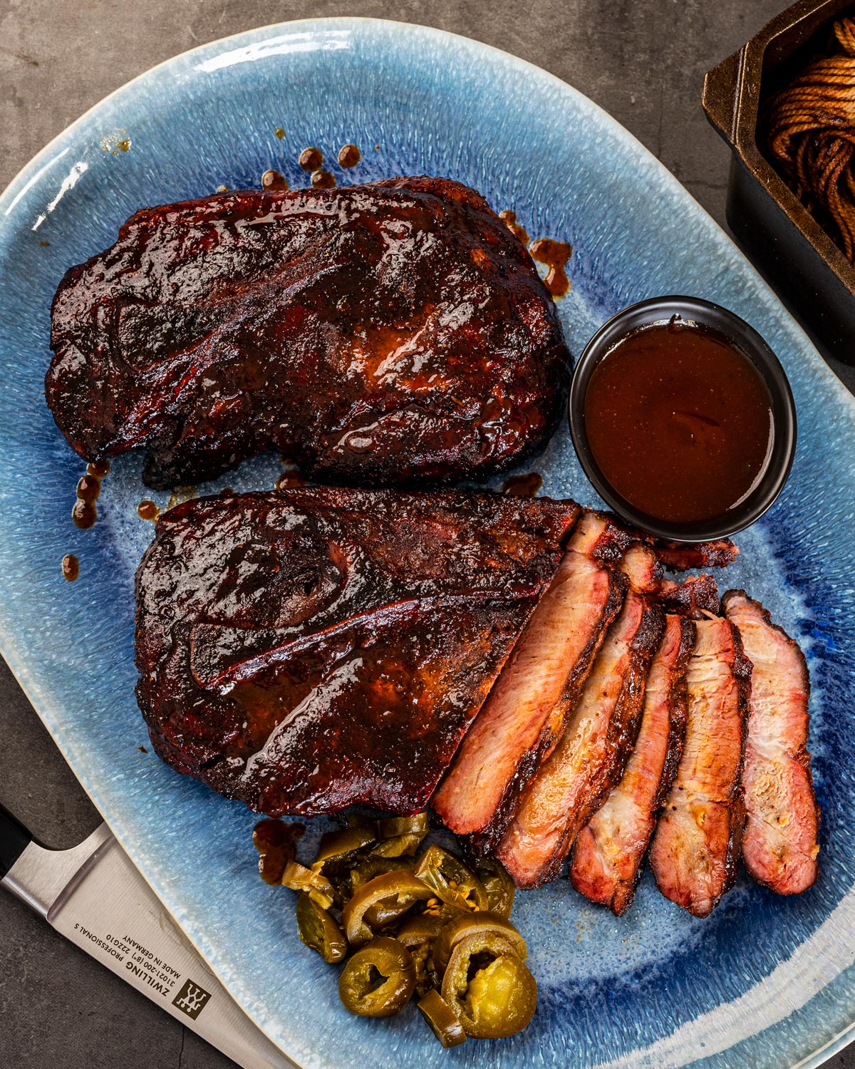 Slice into your smoked pork steaks, and don't forget the sauce.