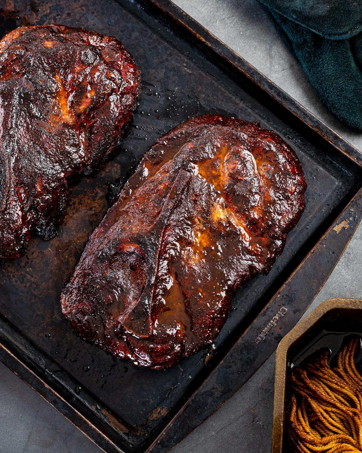 Juicy smoked pork steaks are ready for you to slice.