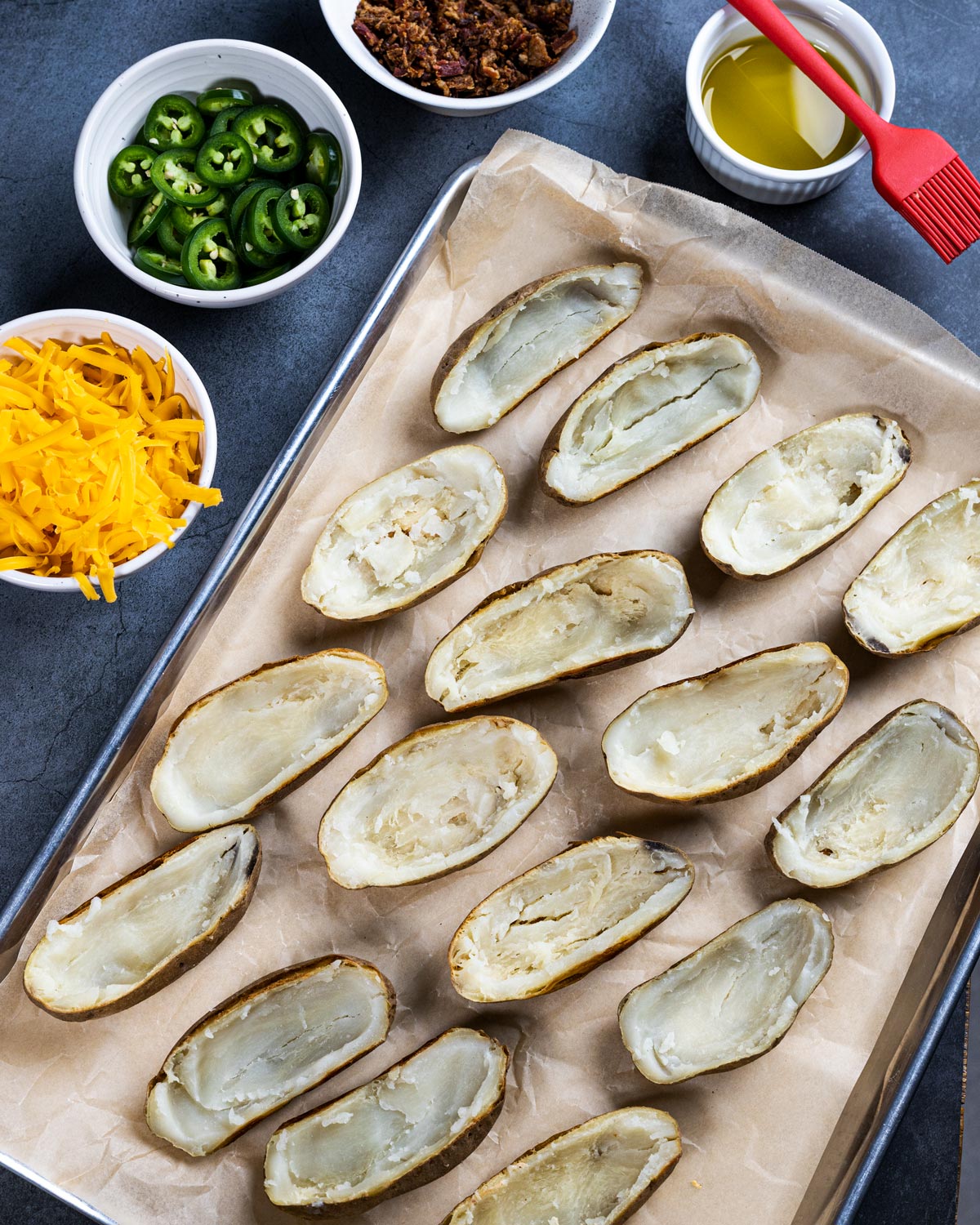 Potato skins are baked potatoes with the flesh scooped out, and then filled with delicious toppings before being smoked.