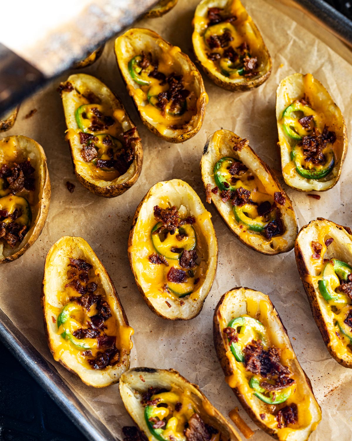 Smoke the potatoes until the edges are crispy and the cheese melts.