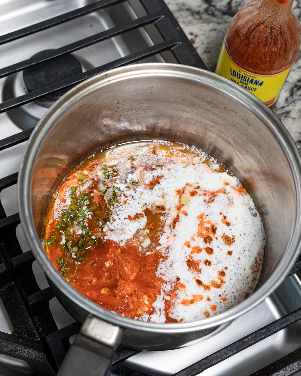 Prepare the mop sauce by warming everything in a small saucepot over the stove.