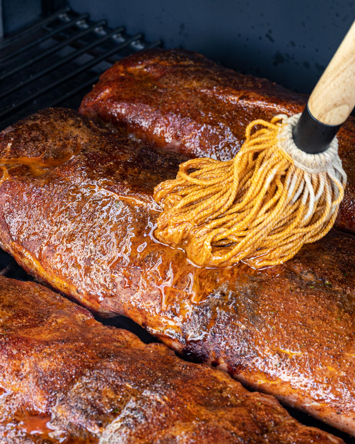 Mop the ribs with some of the sauce after the first hour on the smoker.