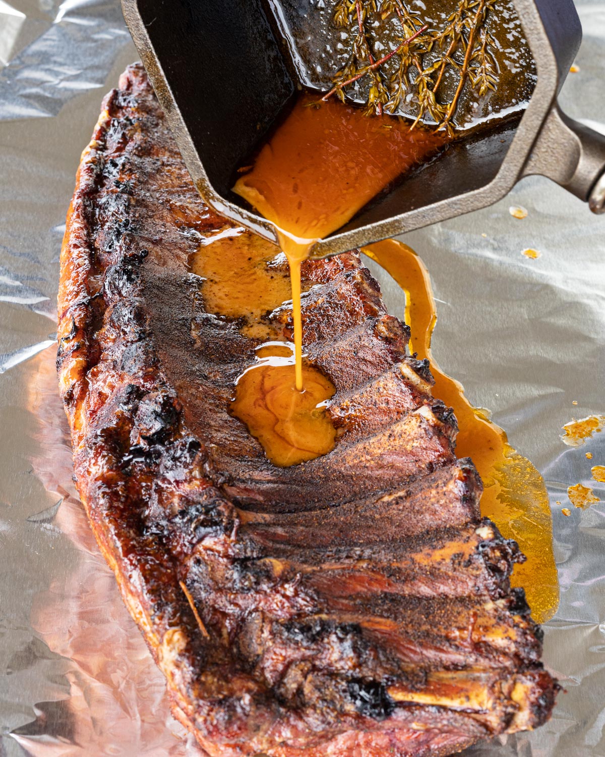 Pour the rest of the mop sauce over the ribs right before they are wrapped in foil.