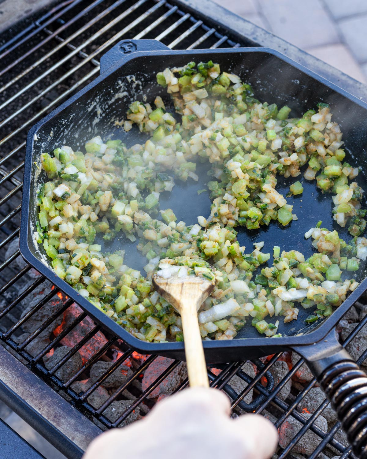 Add in the trinity of celery, onions, peppers, and salt.
