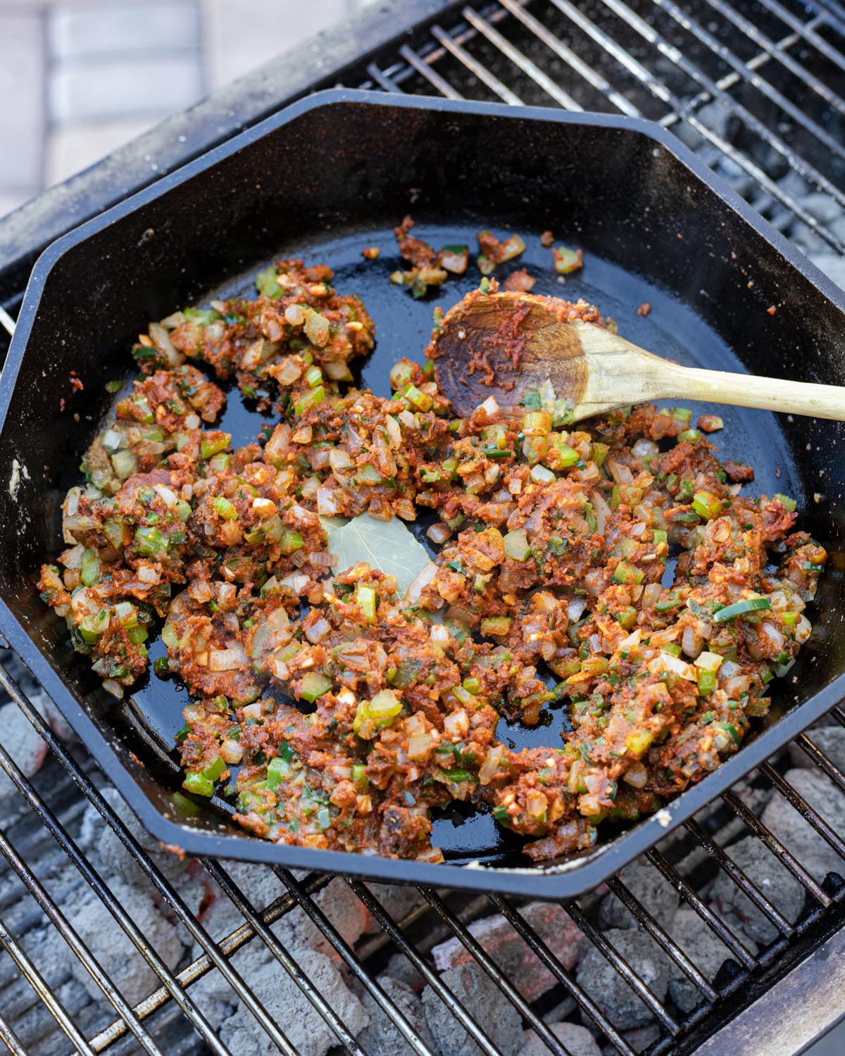 Add in the tomato paste and cook it to remove the raw flavors.