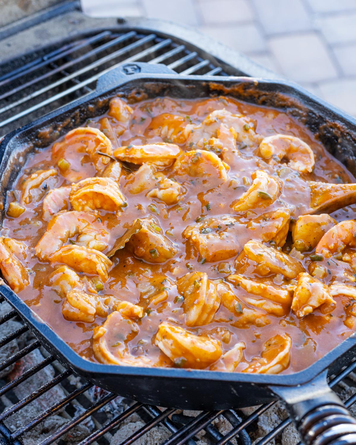 Spicy shrimp etouffee is cooked over the fire and ready to go.