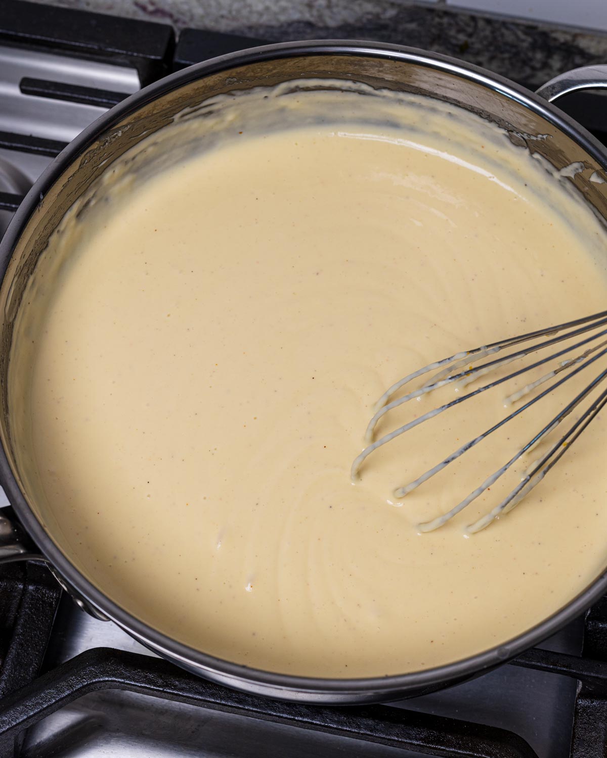 Whisk in the cheeses with the heat turned off.