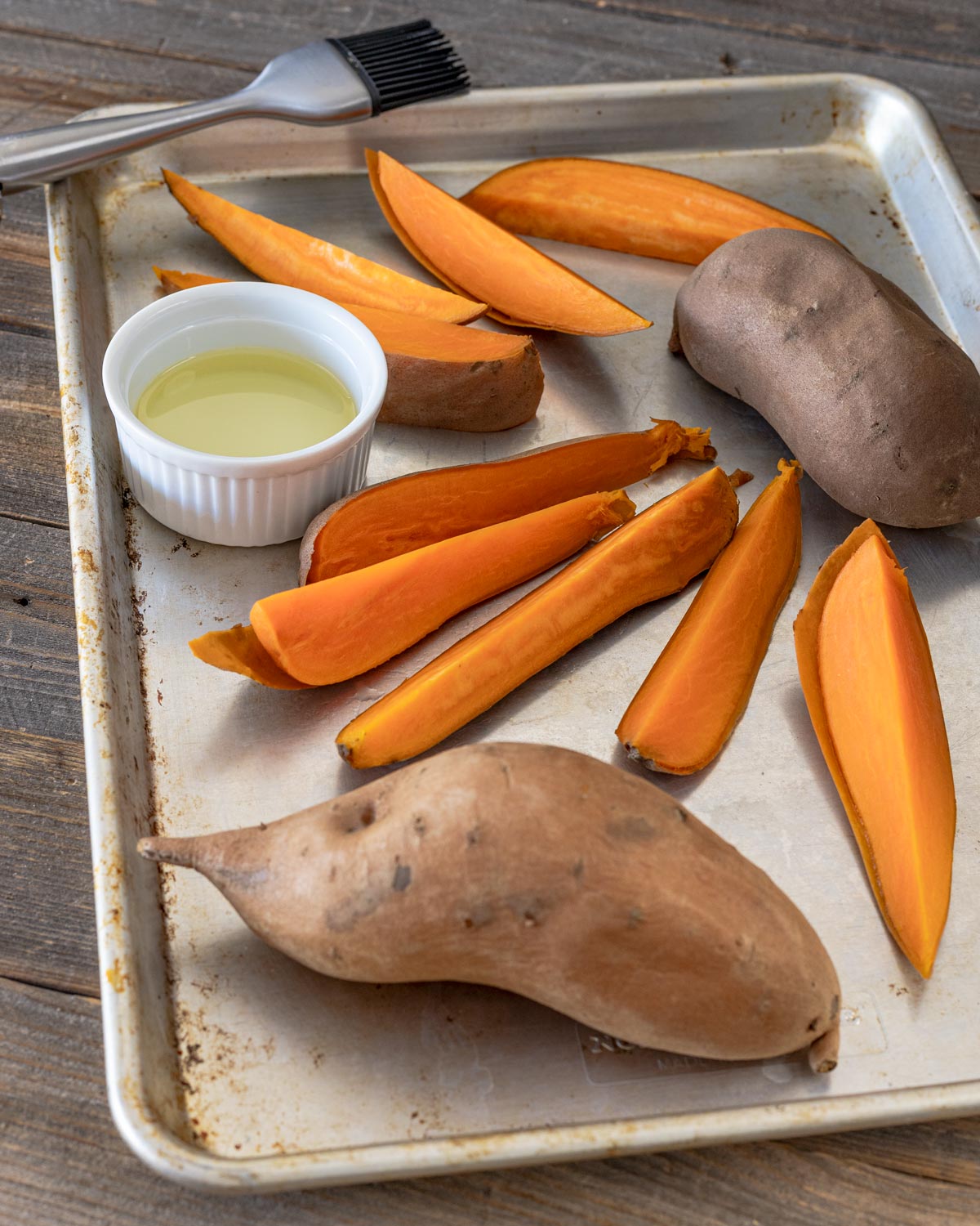Start by slicing par-boiled sweet potatoes into wedges.