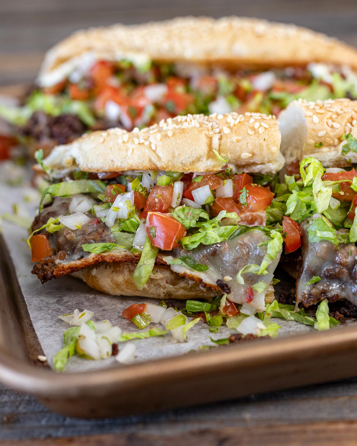 This Mexican chopped cheese sandwich has pico de gallo, pepper jack cheese, and shredded lettuce.