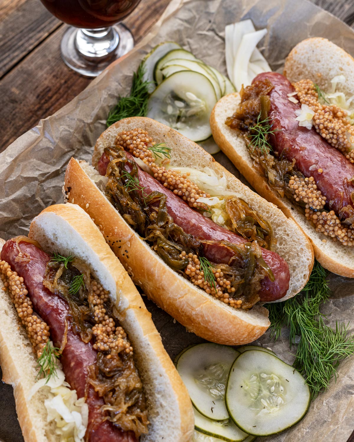 Smoked brats topped with beer onions and pickled mustard.