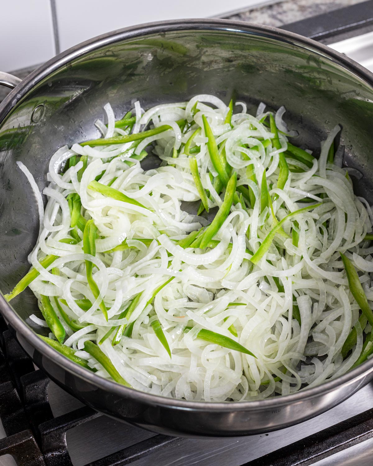 Start caramelizing the onions and jalapenos low and slow in a saute pan.