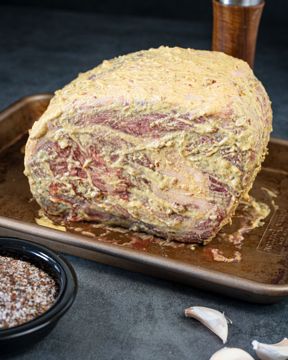 prime rib roast coated in a dijon and chipotle adobo paste before seasoning