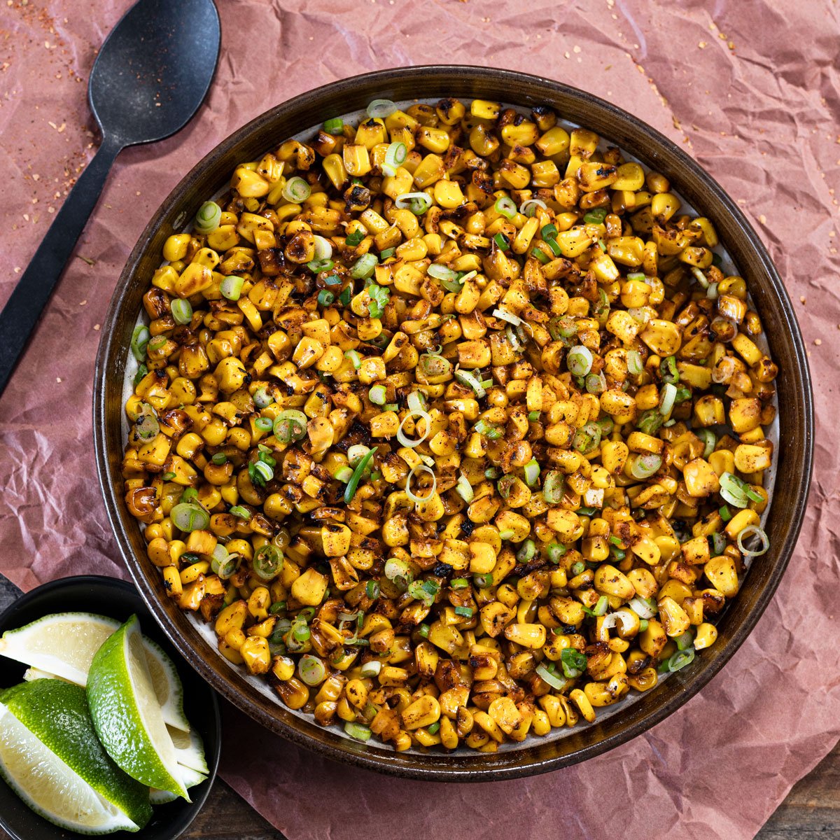 Take a spoonful of this blackened corn with melted butter and herbs.