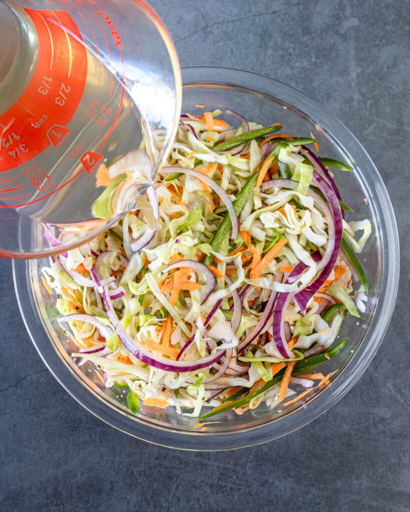 Pour the hot brine over the vegetables before transferring to a clean mason jar.