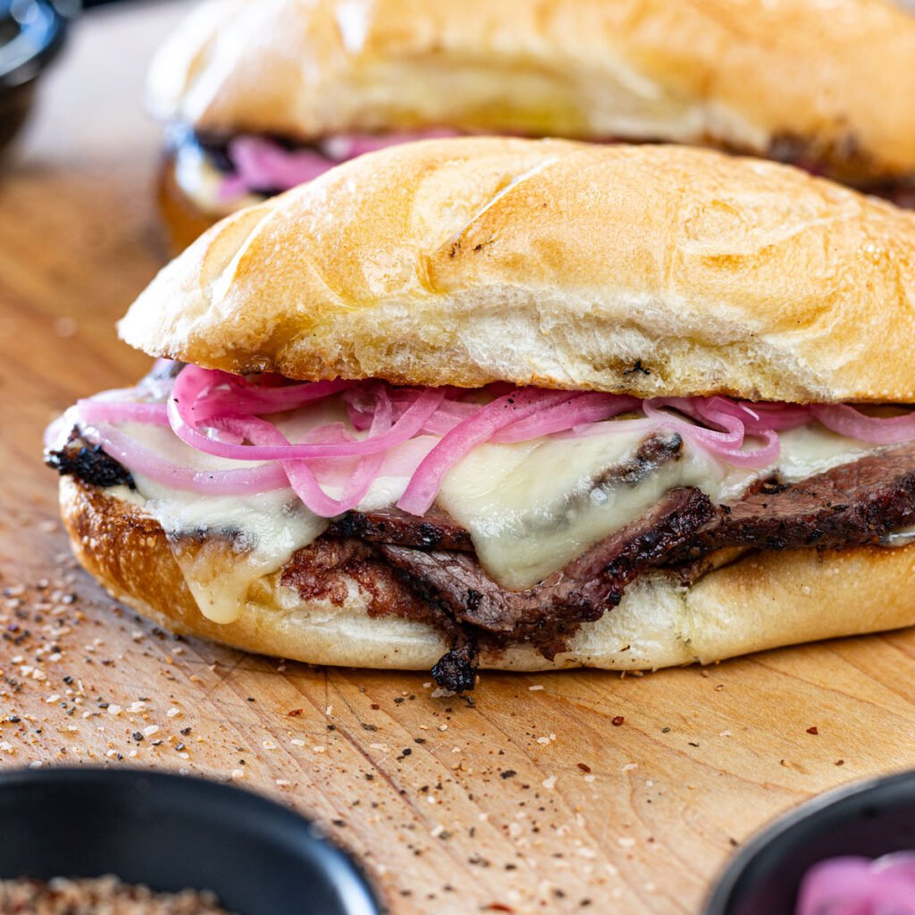 Cheesy tri tip sandwich with horseradish aioli.