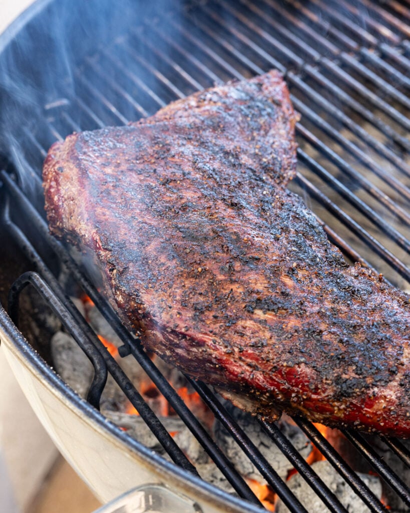 Sear the tri tip after smoking, which is the second phase for reverse searing.