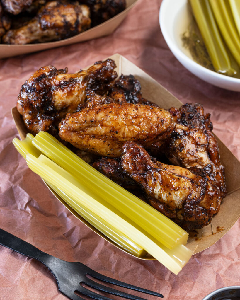 Quick pickled celery tastes delicious alongside grilled chicken wings.