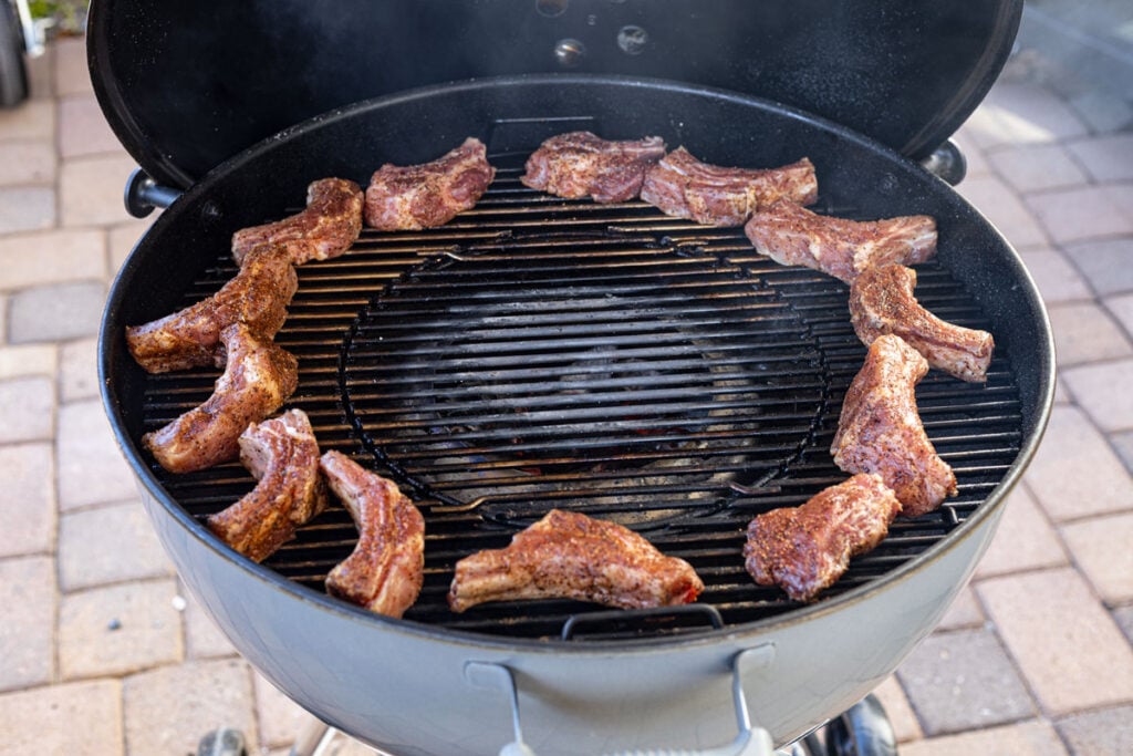 Cook the party ribs indirectly from the heat using a pellet grill or charcoal grill.