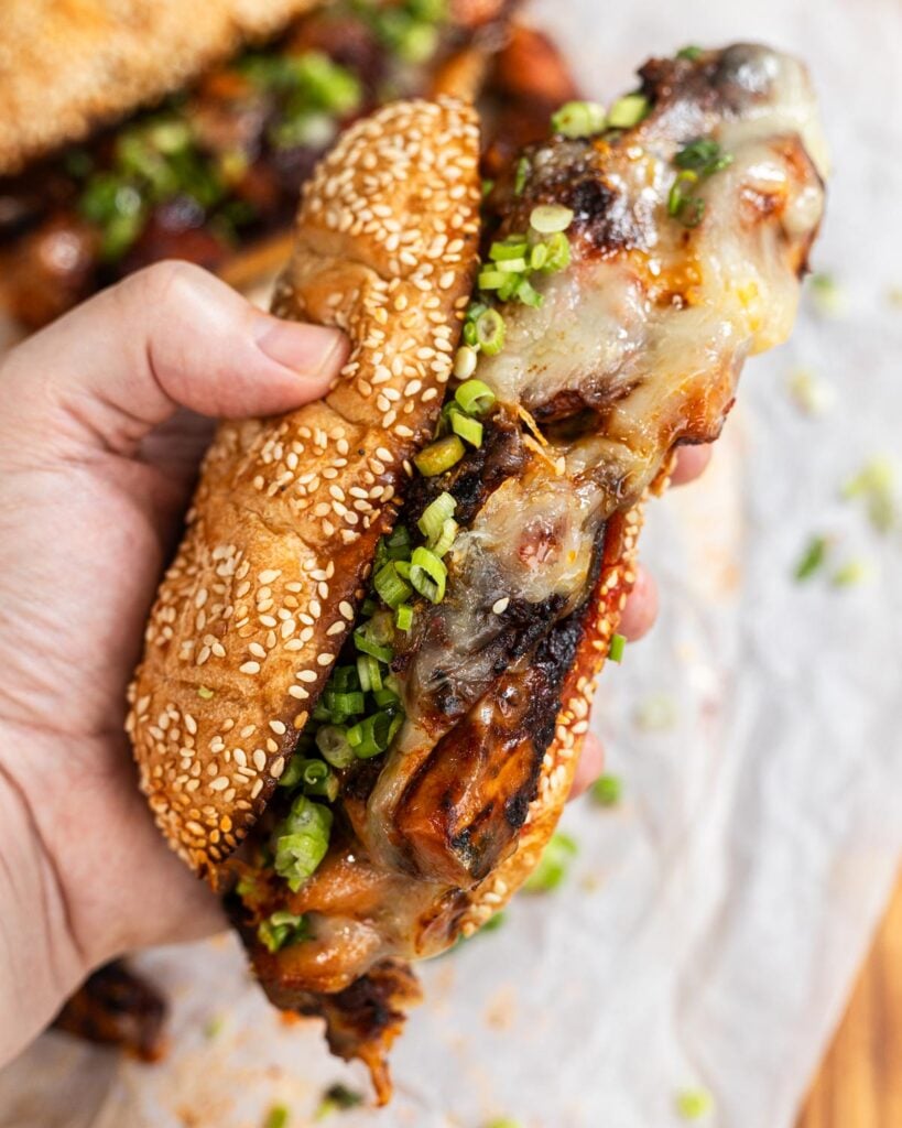 Unwrap your Korean fire chicken sandwiches and top with green onions.