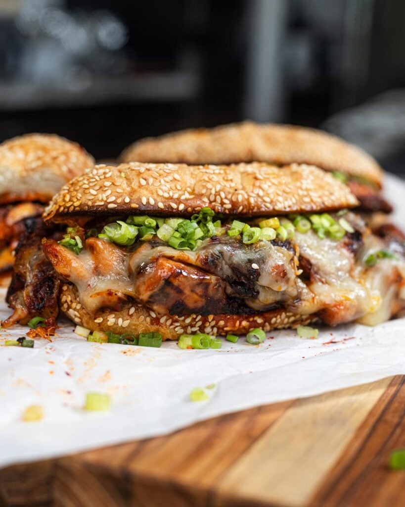 This juicy cheese buldak sandwich is spicy and sweet.