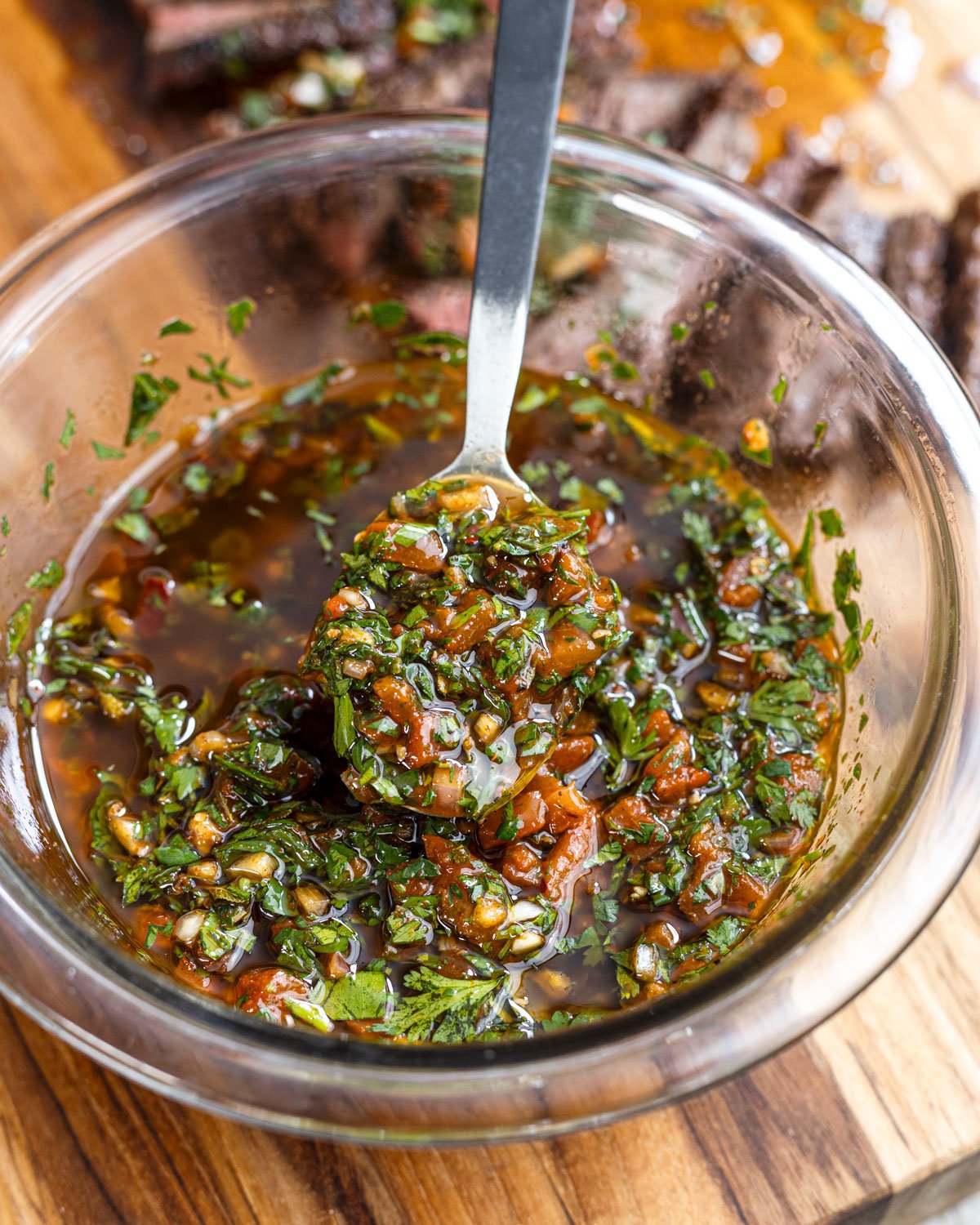 Red chimichurri sauce has red bell peppers, chipotle, and fresh herbs.