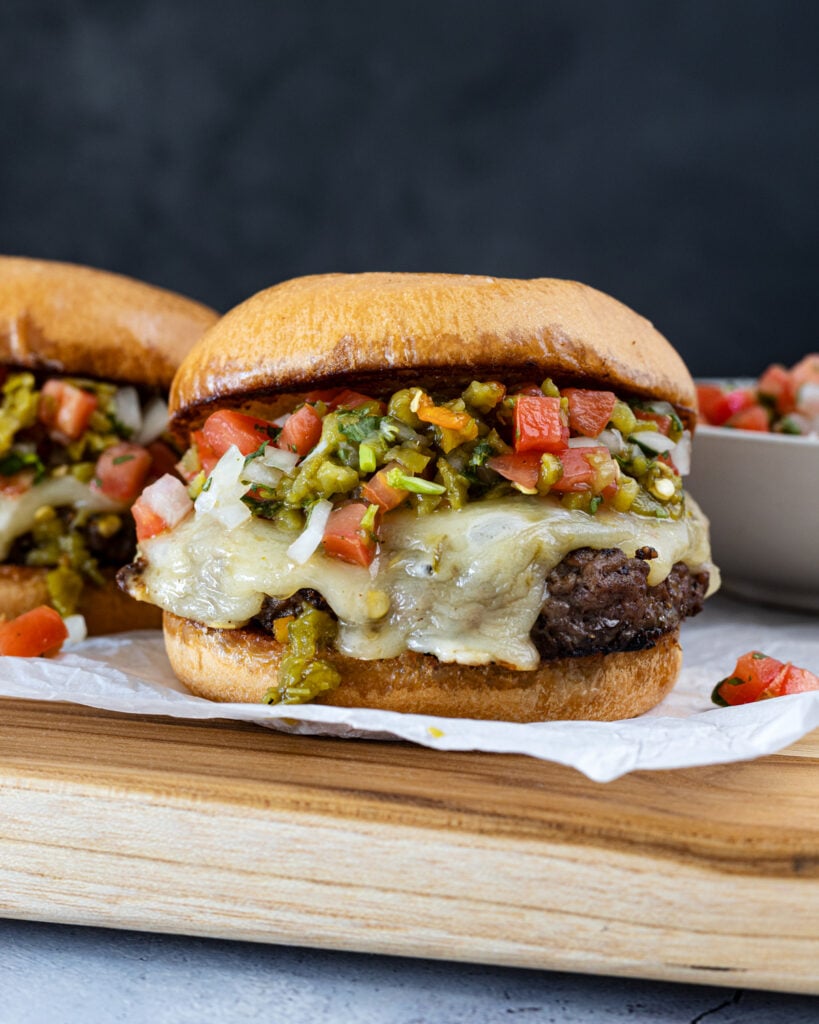 Cheesy queso burger with Hatch chiles and salsa
