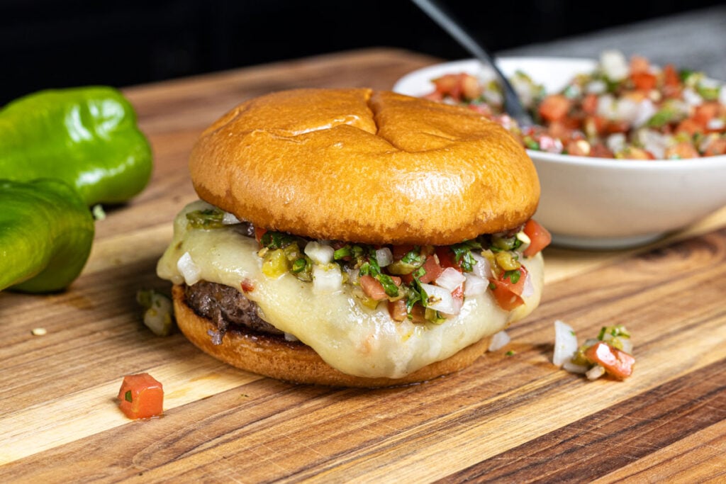 Grab a cheesy queso burger, loaded with roasted hatch chiles and fresh salsa.