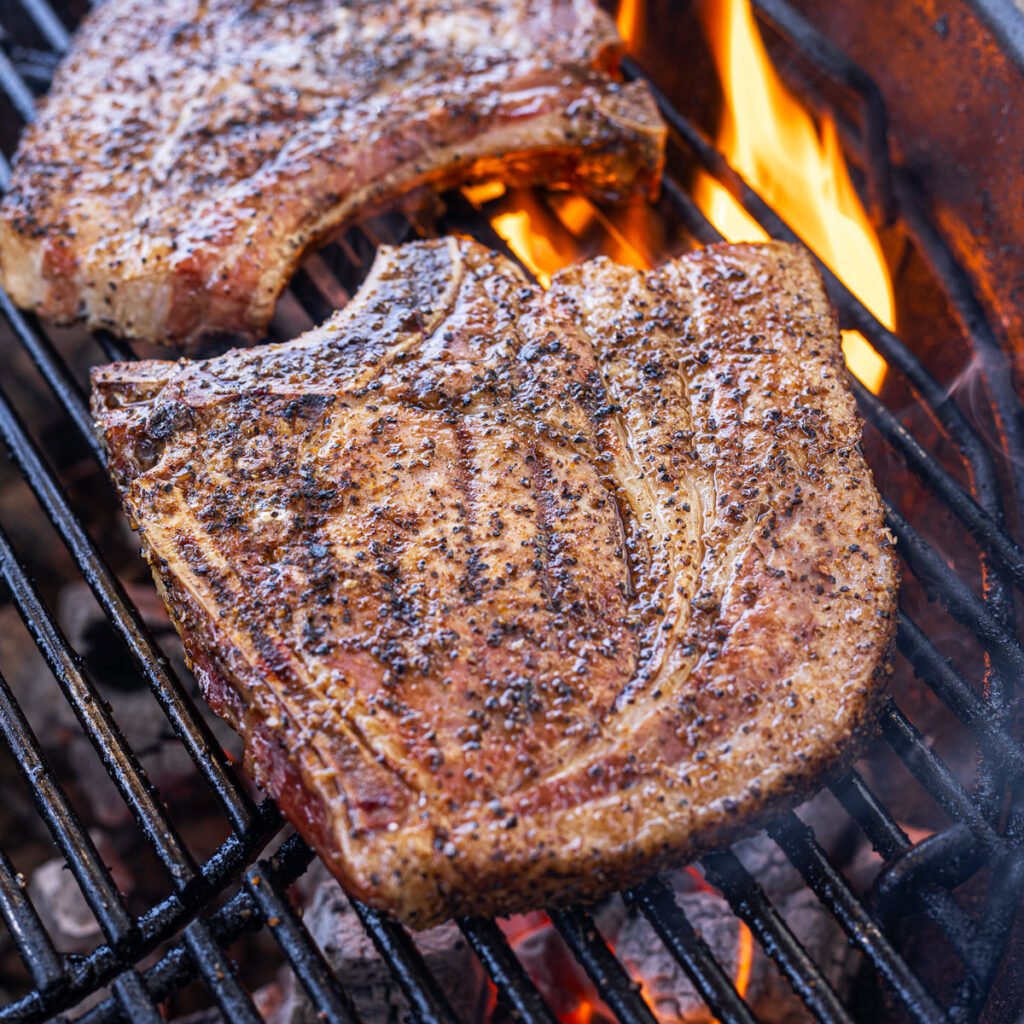 Smoked bone-in pork chop on the grill.