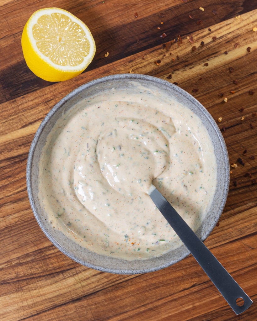 Mixed ingredients for the cowboy butter ranch dressing in a bowl