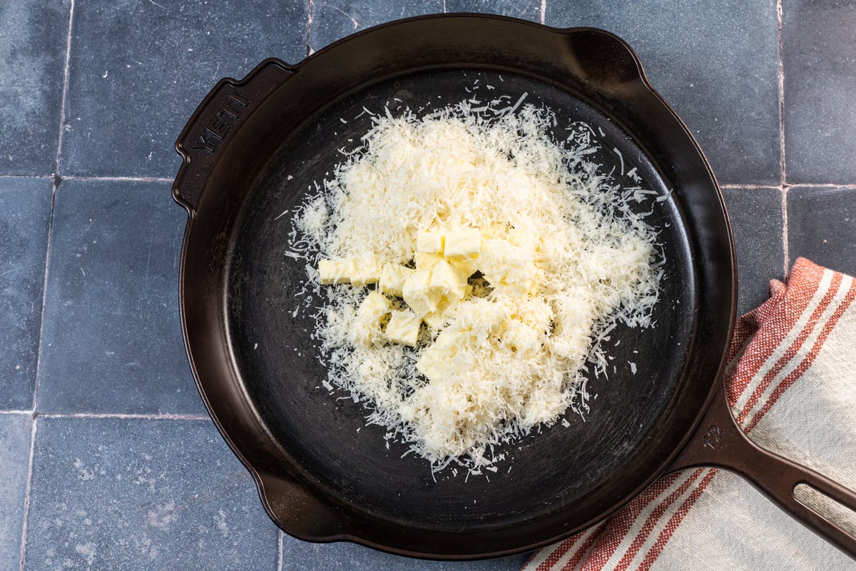 Butter and grated parmesan in a skillet