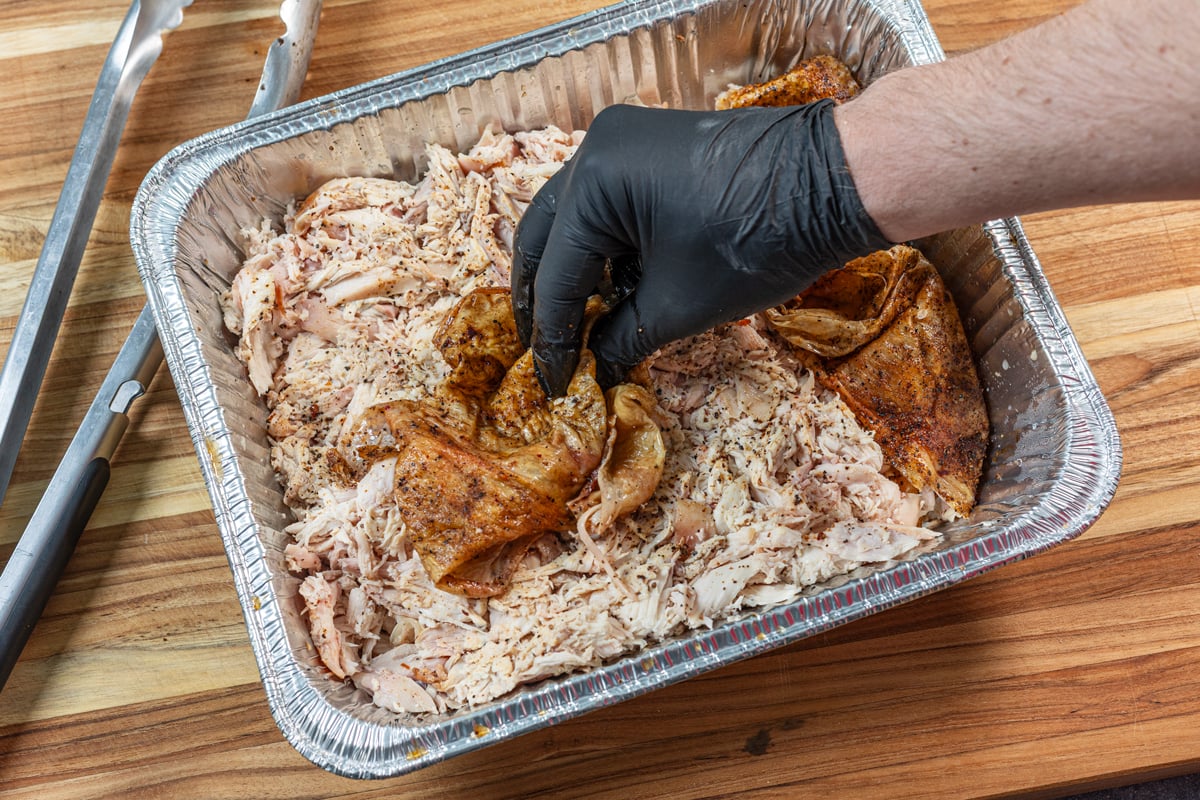 Setting aside the chicken skin to later chop and redistribute.