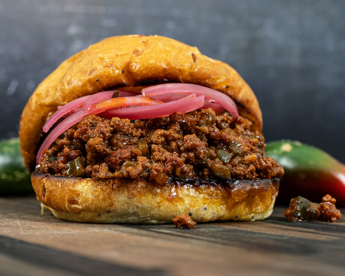 Smoked sloppy joe with pickled red onions and fresh jalapeños alongside