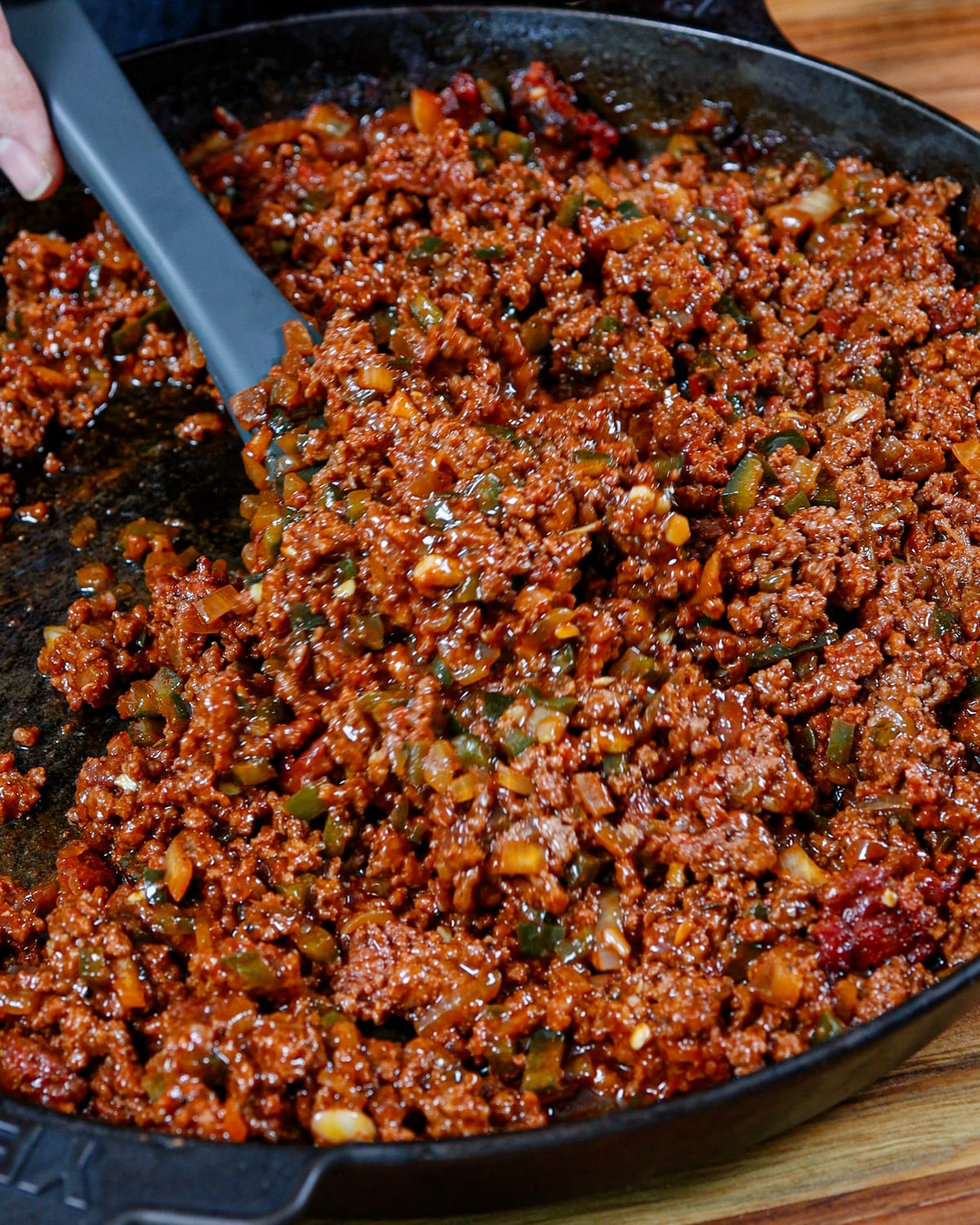 Finished smoked sloppy joe filling, loose and saucy in cast iron