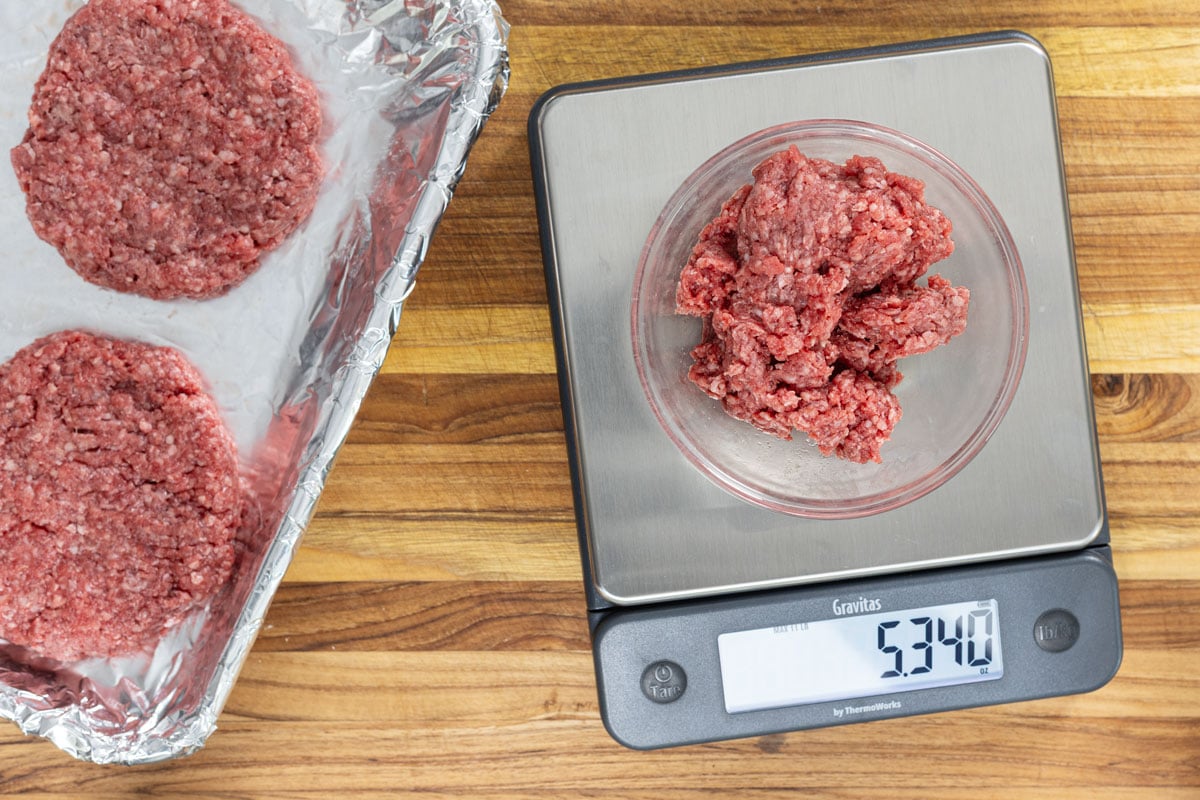 Raw ground beef for picanha burger patties on a kitchen scale