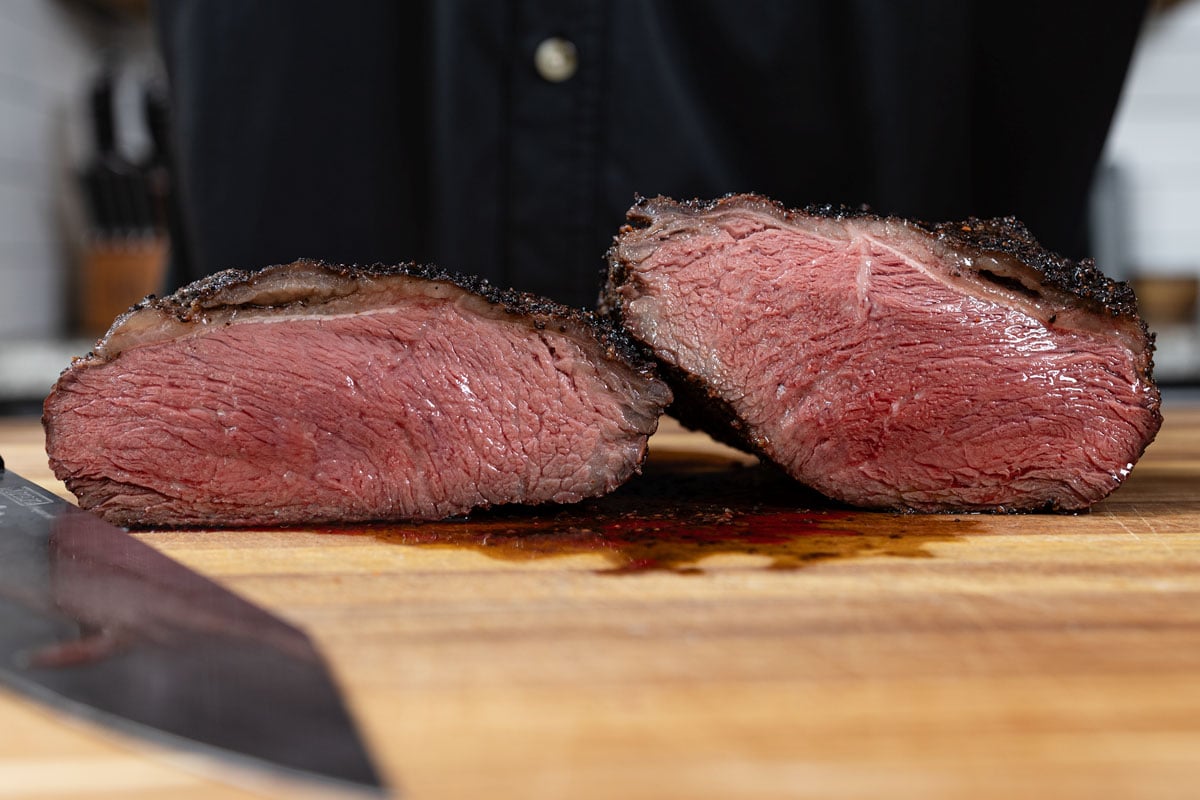 Sliced reverse-seared picanha showing an evenly pink, rare interior